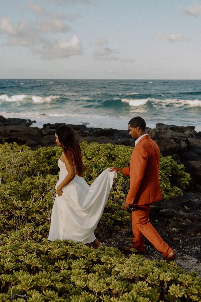 Couple walking by ocean