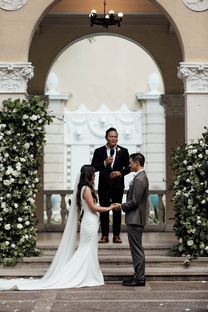 Couple exchanging vows at wedding ceremony